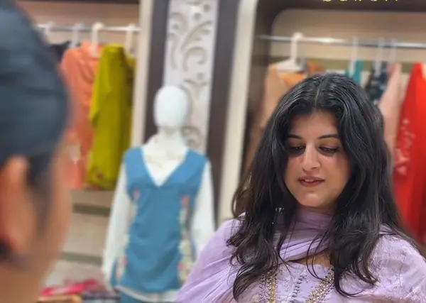 Customer choosing a lavender suit