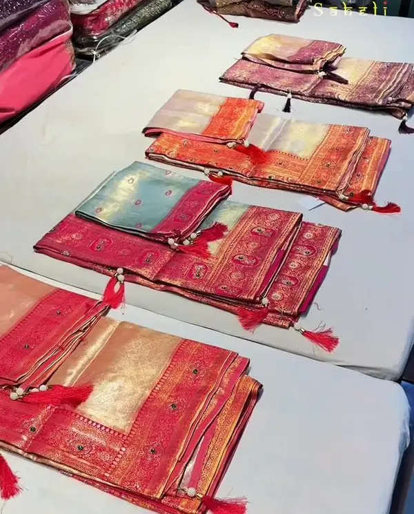 Silk sarees laid out at Saheli