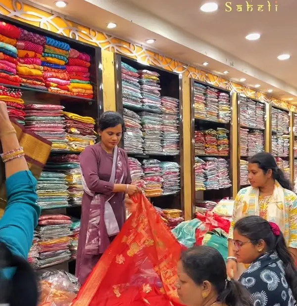 Customers browsing sarees at Saheli