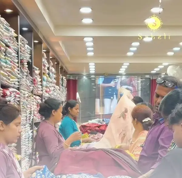 Bright showroom aisle at Saheli